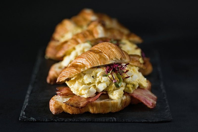 breakfast croissant with scrambled egg and bacon