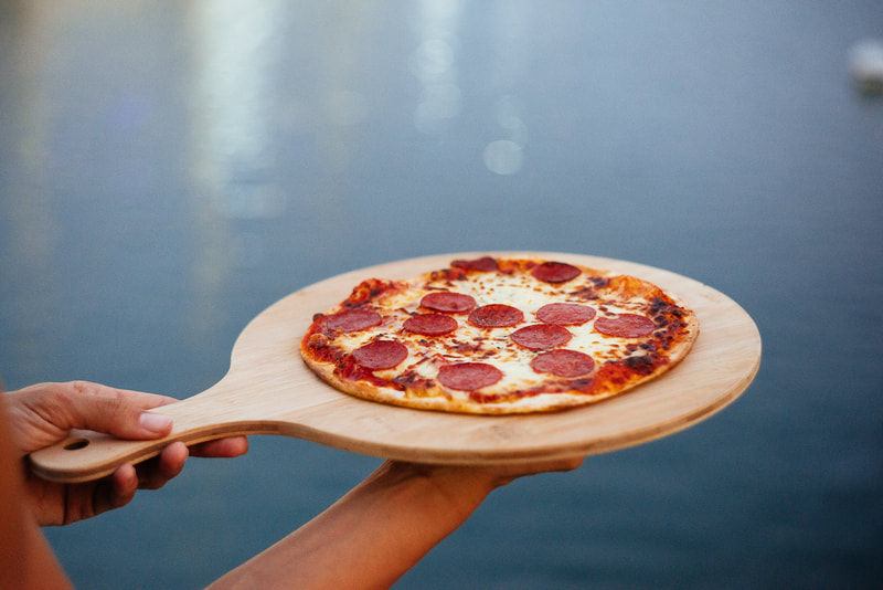a pizza on a pizza board