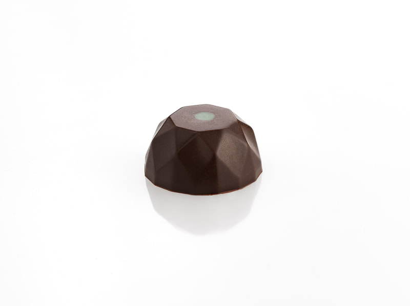 Igloo shaped chocolate on a white background