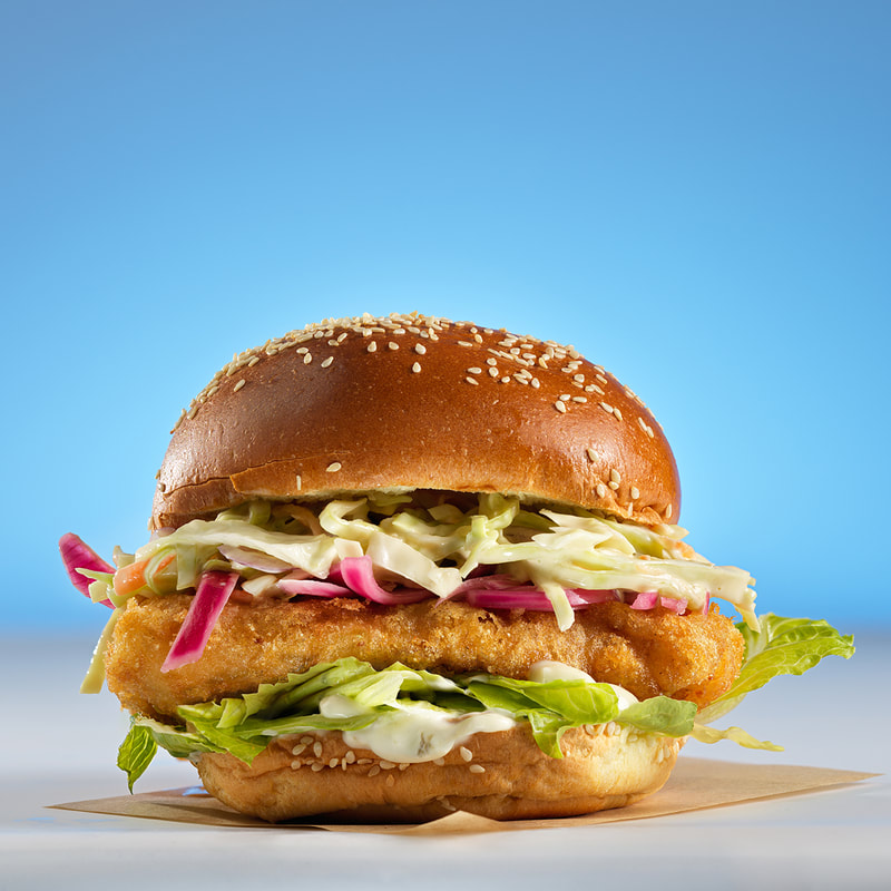 a fried chicken burger with cold slaw